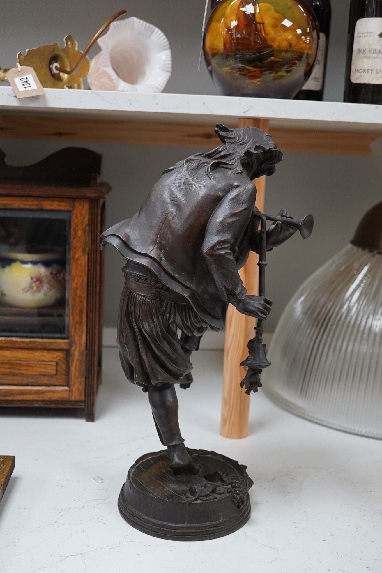 After Charles Lebourg (French, 1829-1906), a bronze sculpture, ‘The Piper’, 44cm high. Condition - good